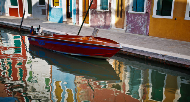 Boat and Reflection of Colorful Houses